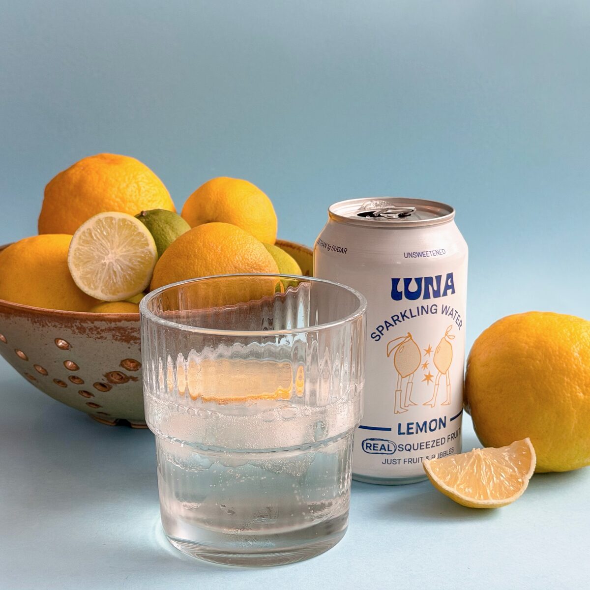 Luna Lemon sparkling water can with fresh lemons